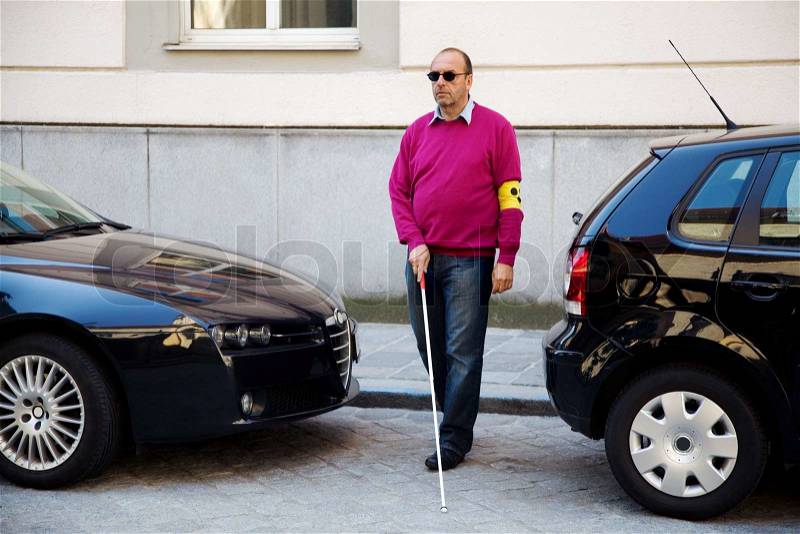 1953528-100425-a-blind-man-walks-with-a-