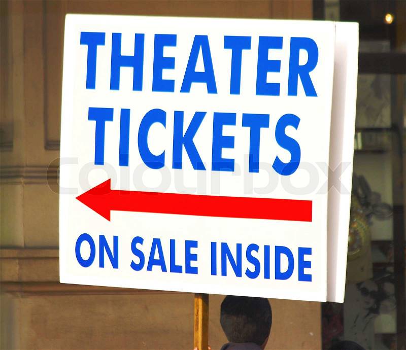 Stock image of 'Handheld Sign For Theater Tickets On Sale'