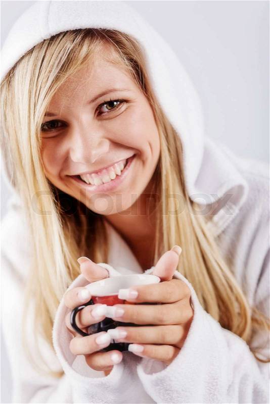 http://www.colourbox.com/preview/2376342-634177-blond-girl-wearing-white-hoodie-holding-cup-of-hot-coffee-smiling-and-looking-at-camera.jpg