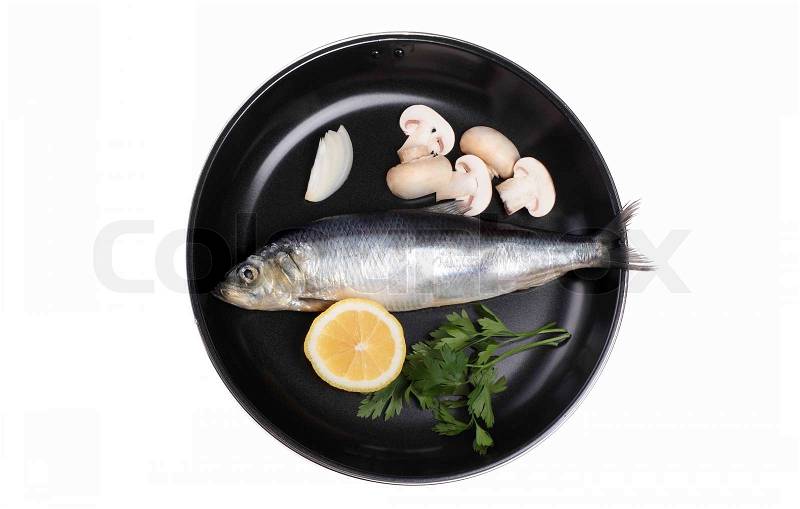 Stock image of 'fish in pan with vegetables isolated on white'