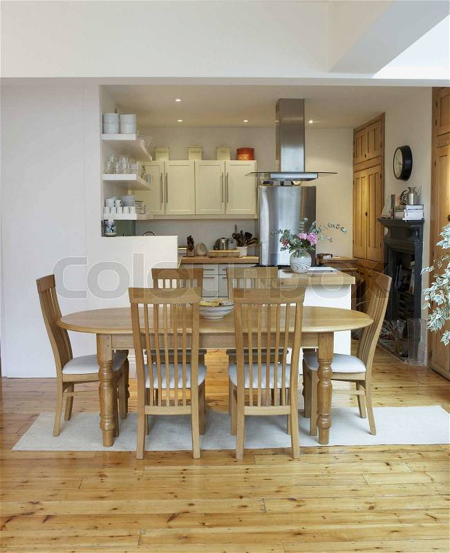 Stock image of 'Empty kitchen and dining room with open floor plan'