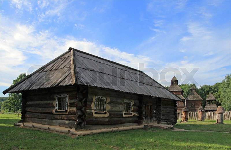 2896724-576855-historical-country-wood-house-and-church-behind-stump-beehive-in-courtyard-preceding-century-museum-of-ukrainian-folk-architecture-in-pirogovo-village-near-kiev.jpg