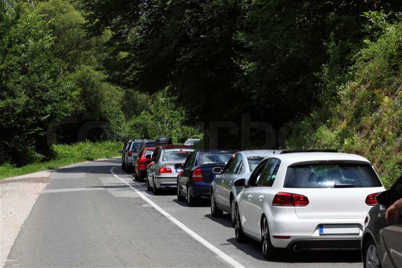 Stock image of 'Cars in a traffic jam on a country road'