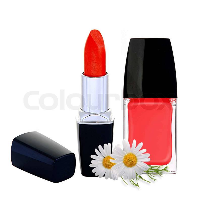 Stock image of 'red nail polish, lipstick and chamomile flowers isolated on
