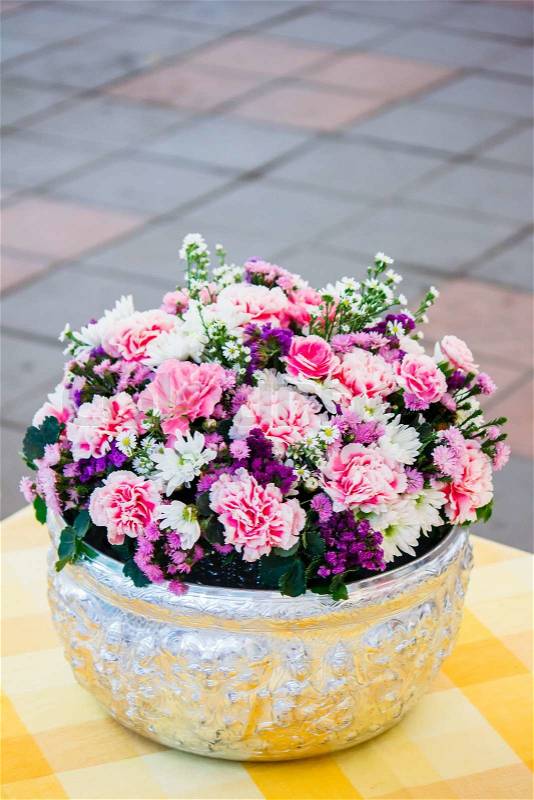 Colorful flower bouquet arrangement in round shape of carnation and white rose, stock photo