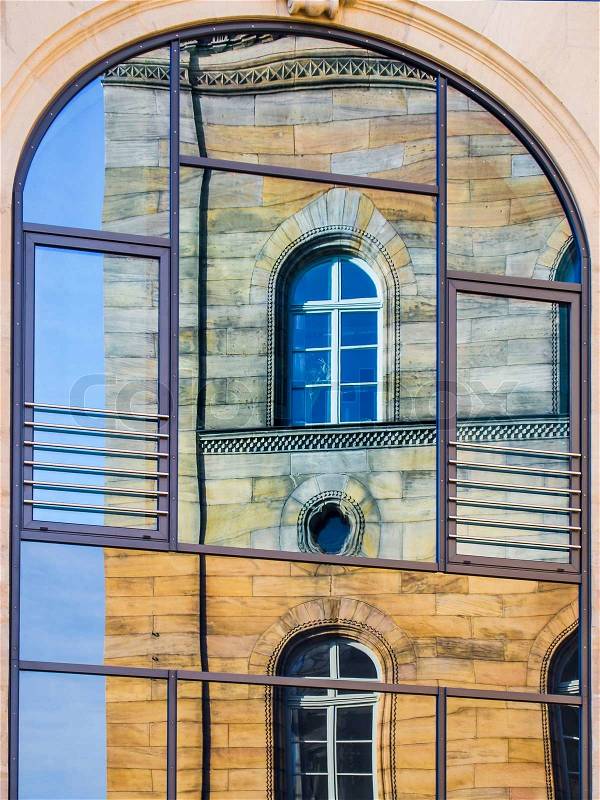 Mirroring of a old house in window in Fürth Germany, stock photo