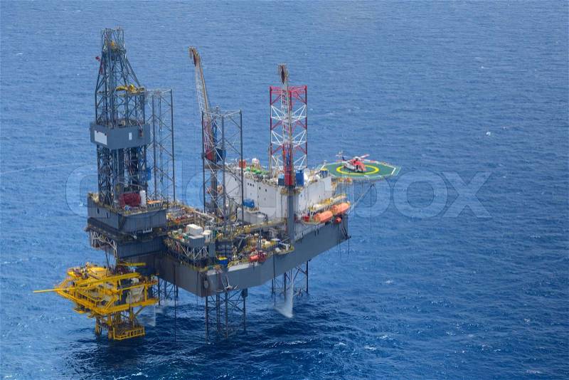 Top view of helicopter pick up passenger on the offshore oil rig, stock photo