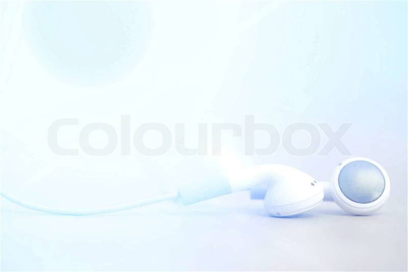 Modern and small earphones on a desk, stock photo