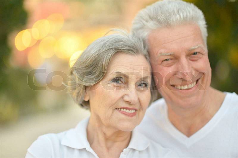 Beautiful happy old people in the summer park, stock photo