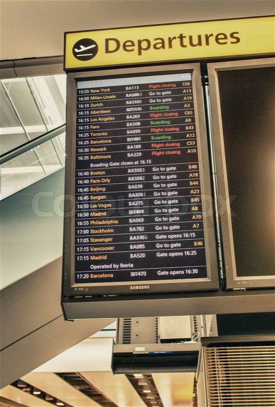 An Airport Departures monitor showing flight times flight status and destinations, stock photo
