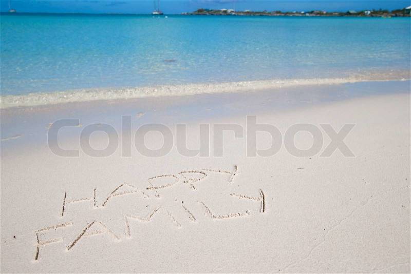 Happy family written on tropical beach white sand background bluy sky, stock photo