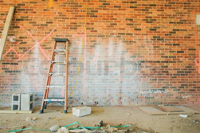 Construction Place with Small Ladder and Dirty Brick Wall, stock photo