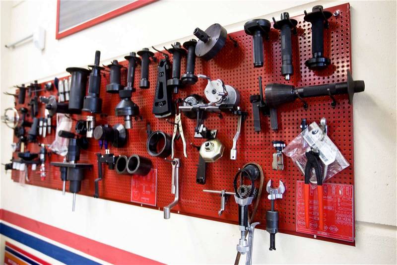 Tools hanging on a garage wall, stock photo