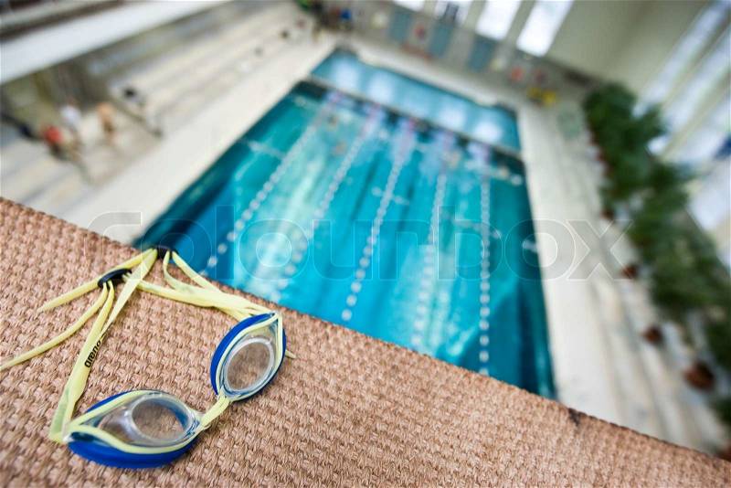 Swimming googles on a diving board, stock photo