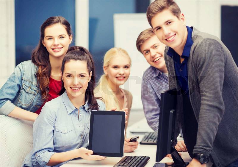 Education, technology and internet concept - students with monitor and blank tablet pc screen, stock photo