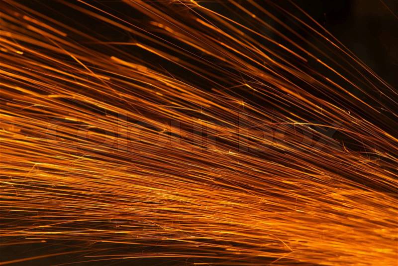 Glowing flow of sparks in the dark,Sparks background, stock photo