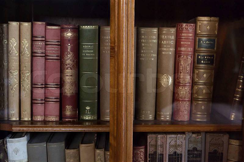 Historic old books in a old library, stock photo