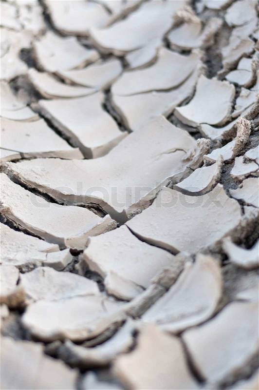 Cracked soil ground into the dry season, stock photo