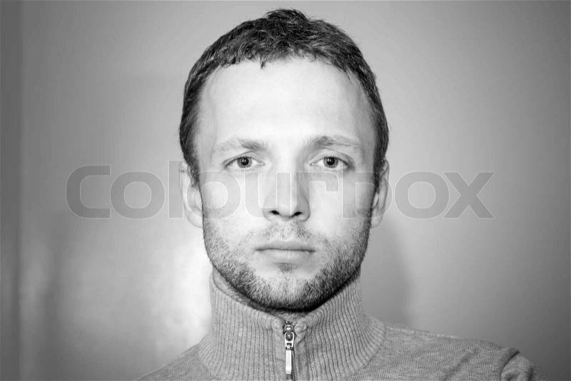 Young Caucasian Man closeup black and white portrait, stock photo