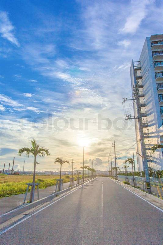 Sun and blue sky with asphalt road, stock photo