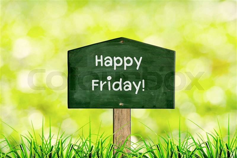 Green sign board with natural background and message Happy Friday, stock photo