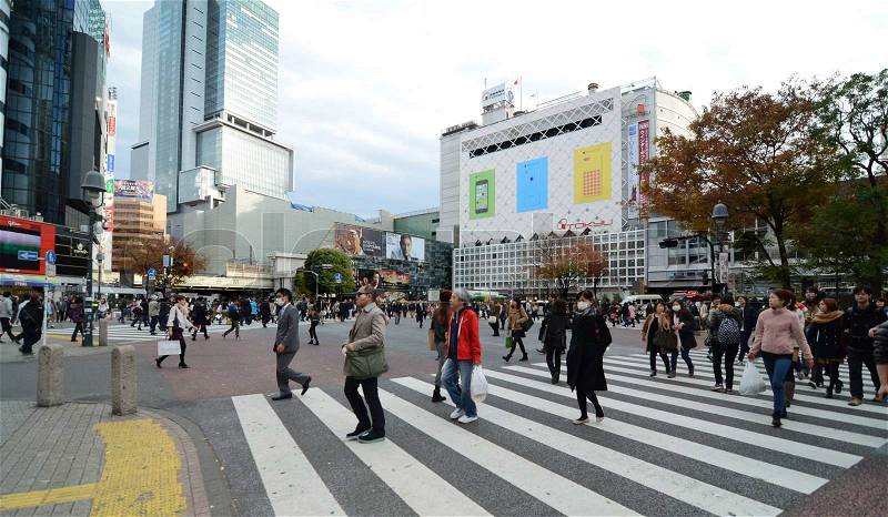 TOKYO - NOVEMBER 28: Crowds of people crossing the center of Shibuya in November 28 2013, the most important commercial center in Tokyo, Japan , stock photo