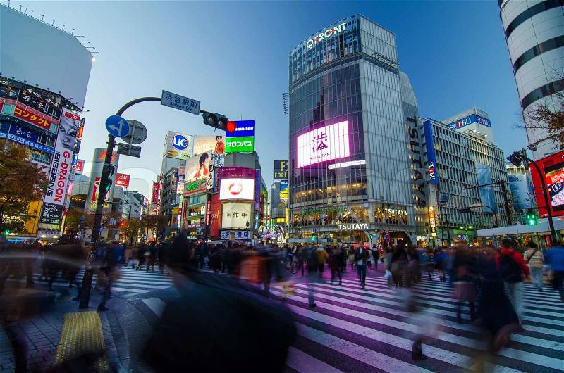 TOKYO - NOVEMBER 28, 2013: Pedestrians at the famed crossing of Shibuya district November 28, 2013 in Tokyo, Japan. Shibuya is a fashion center and nightlife area. , stock photo