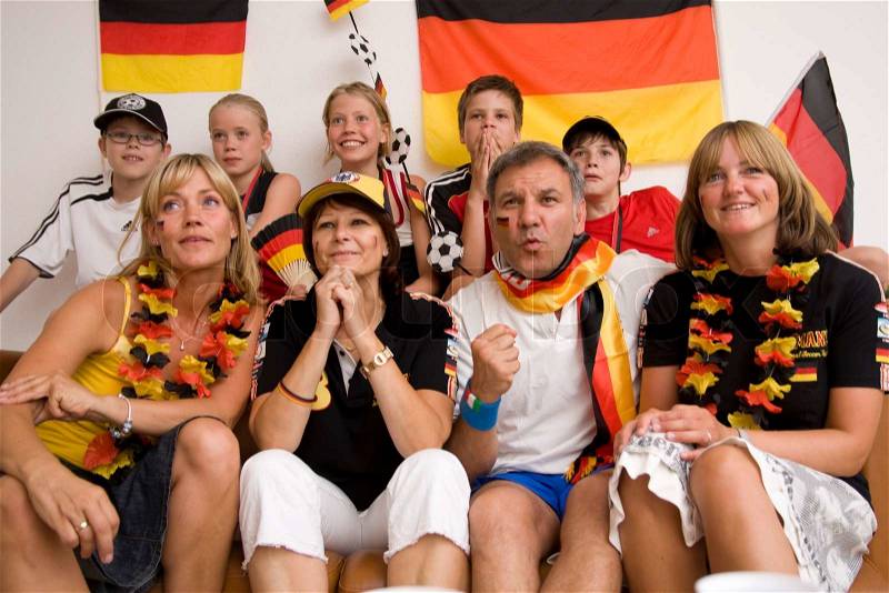 Excited faces of german football fans, stock photo