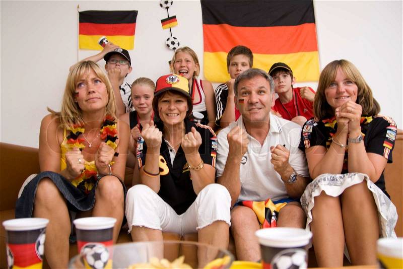 Excited faces of german football fans, stock photo