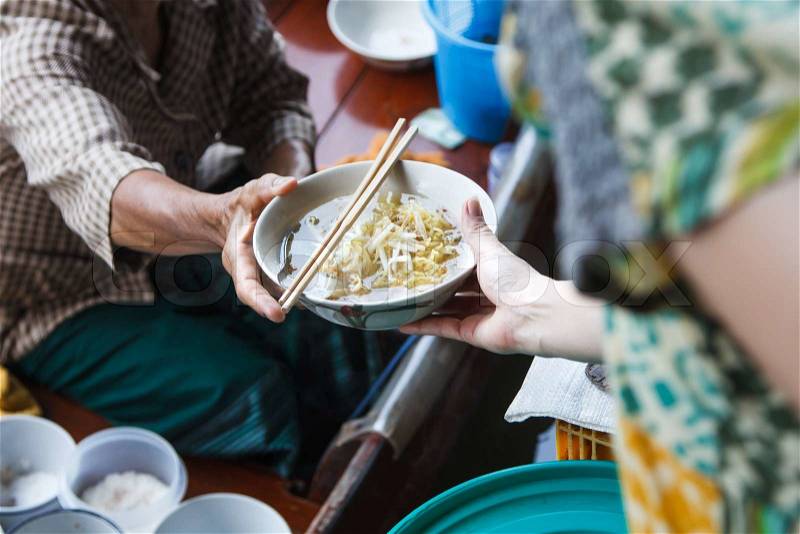 Noodle soup selling on wooden boat in floating market, stock photo