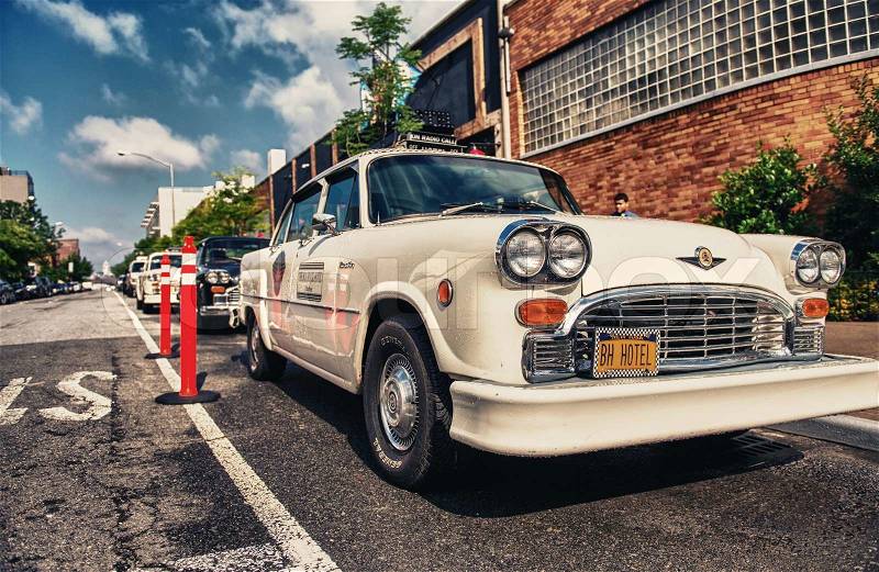 BROOKLYN - JUN 11, 2013: Vintage white taxi cabs await customers. Today, more than 13,000 modern taxis take the place of the old ones, stock photo