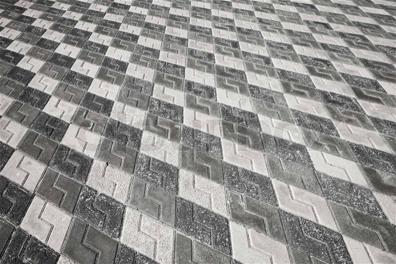 Black and white pattern of urban cobblestone pavement, stock photo