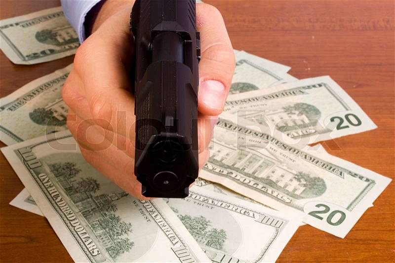 Robbery with the use of a gun, stock photo