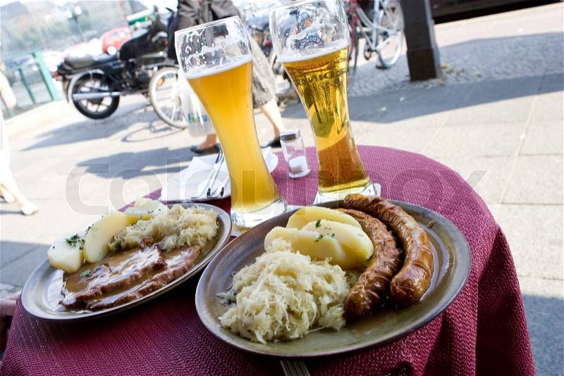 German food on plates and cold beer, stock photo