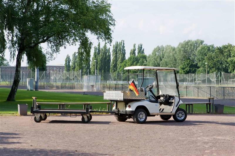 Empty golf cart with German flag, stock photo