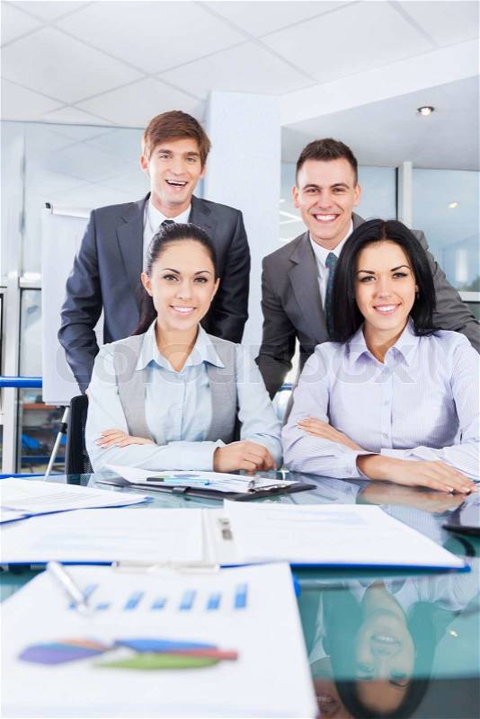Group of business people working at office desk work together, businesspeople colleague team sitting at desk in office, stock photo