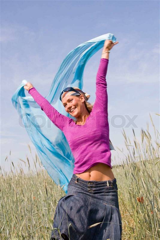 Cancer free caucasian woman in the field, stock photo