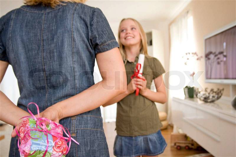 Surprise gift to a teenage girl with good school grades, stock photo