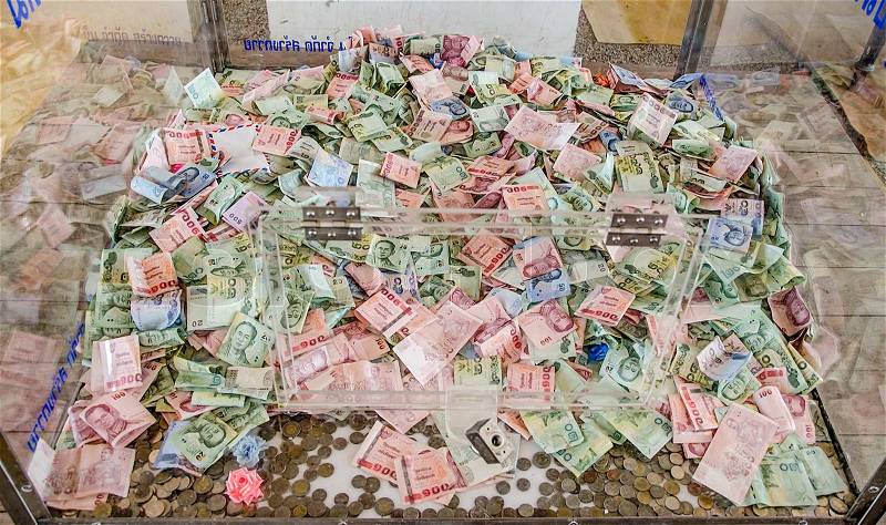 Thai money donation box in the temple, stock photo