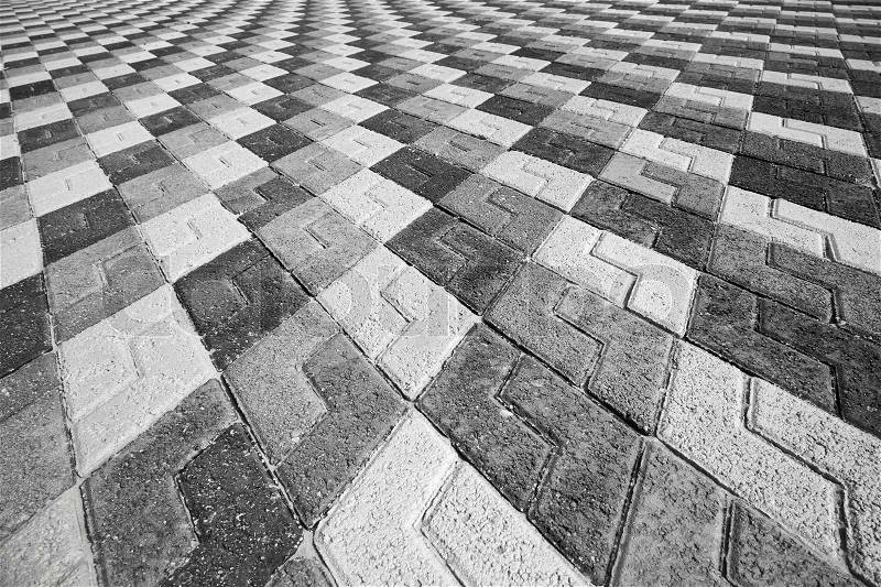 Black gray and white pattern of urban cobblestone pavement, stock photo