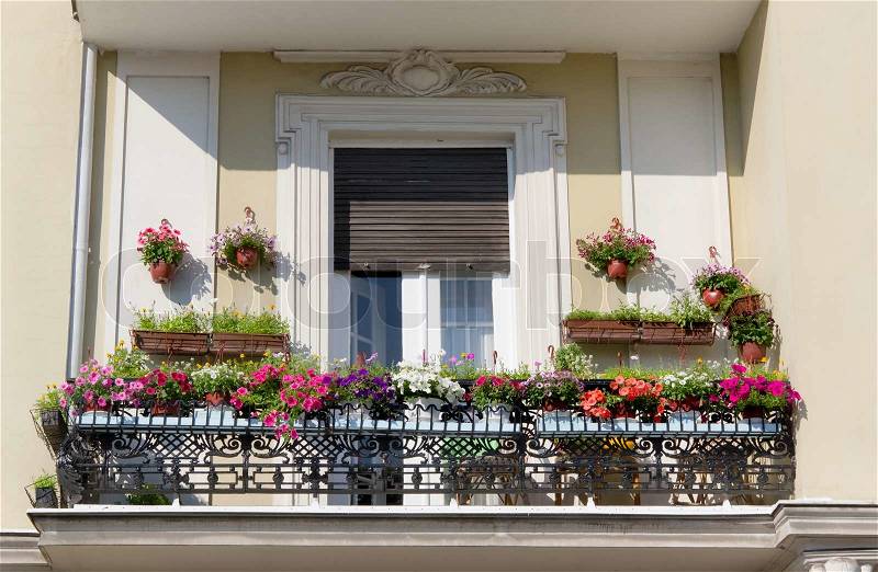 Old balcony with flowers, stock photo