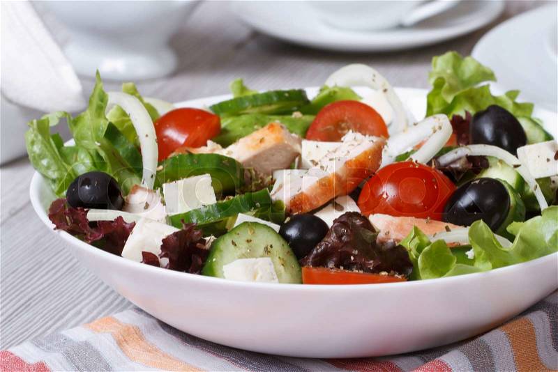 Salad with chicken breast and vegetables on the table close-up. horizontal , stock photo