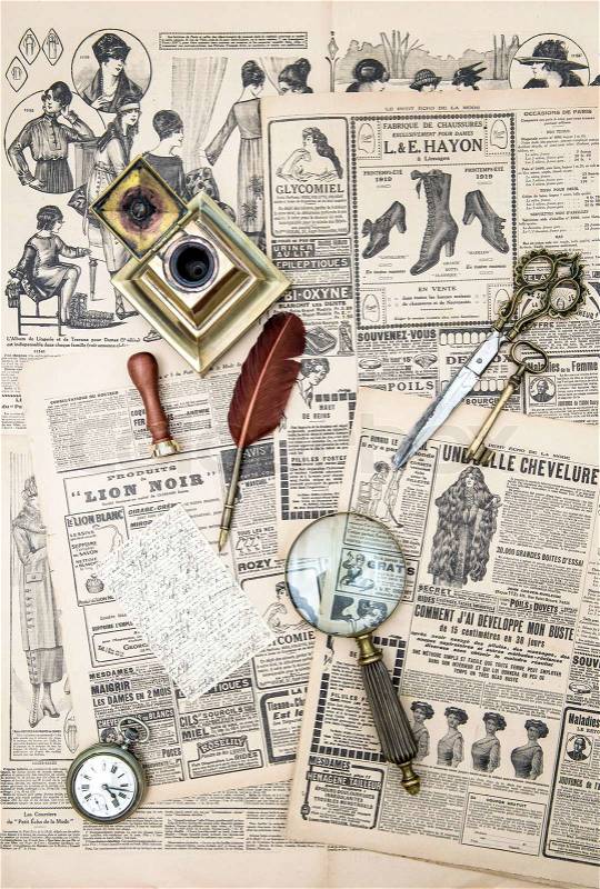 Antique accessories, sewing and writing tools, vintage fashion magazine for the woman. aged paper background, stock photo