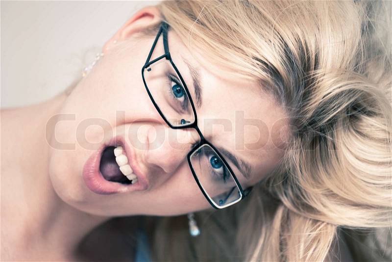 Closeup of excited woman face, stock photo