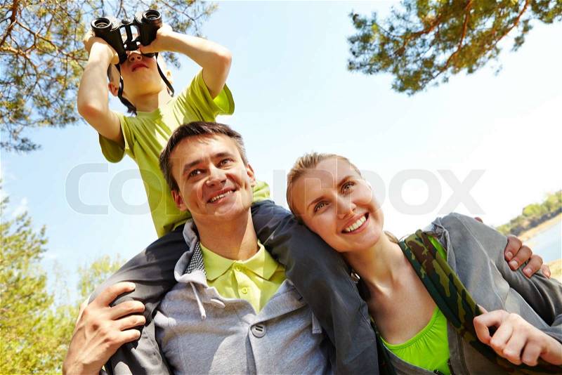 Portrait of family of travelers on summer vacation, stock photo