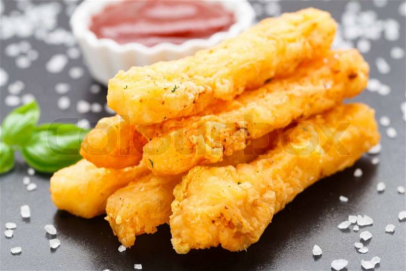Delicious deep fried cheese sticks on a table, stock photo