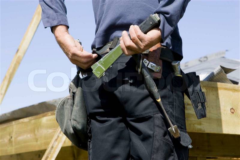 Back of a carpenter with his carpentry tool belt, stock photo