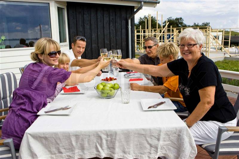 A caucasian family having outdoor lunch, stock photo