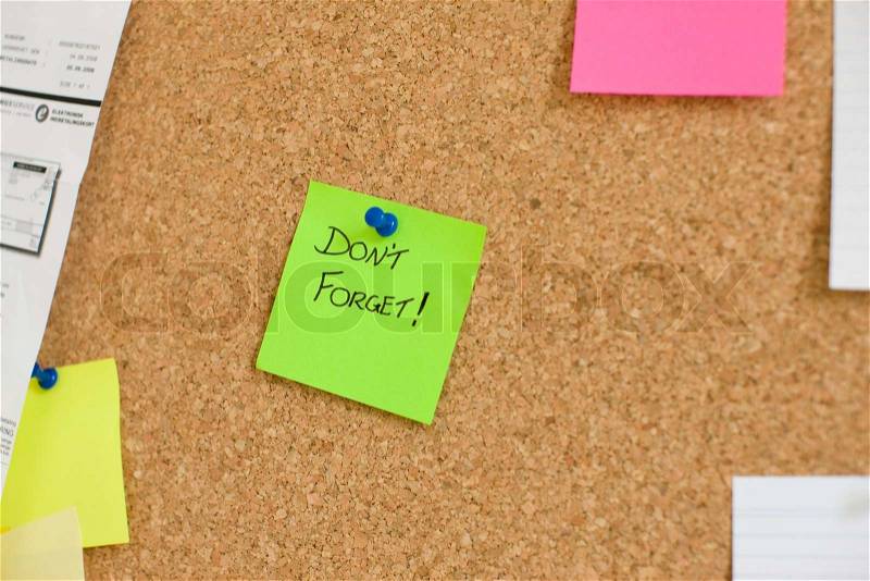 Corkboard with post-it notes, stock photo