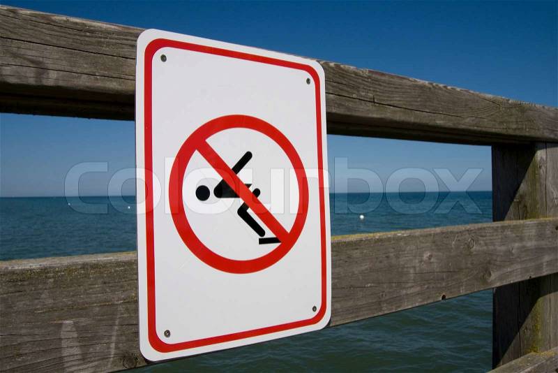 No swimming sign on a wooden bridge, stock photo